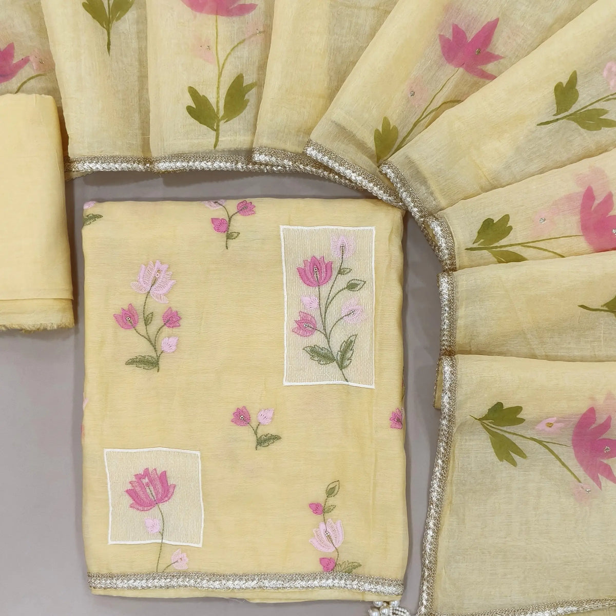 Designer pastel yellow mul chanderi unstitched salwar material,rich floral thread embroidery work on front, ( soft,lining needed)santoon bottom, hand brush paint work on mul chanderi dupatta with lace tapping and beaded tassles. OC260903