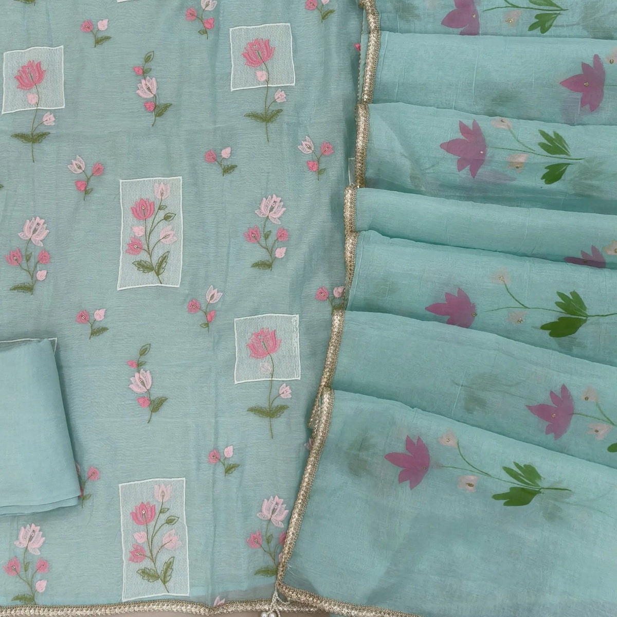 Designer sea green mul chanderi unstitched salwar material,rich floral thread embroidery work on front, ( soft,lining needed)santoon bottom, hand brush paint work on mul chanderi dupatta with lace tapping and beaded tassles. OC260901