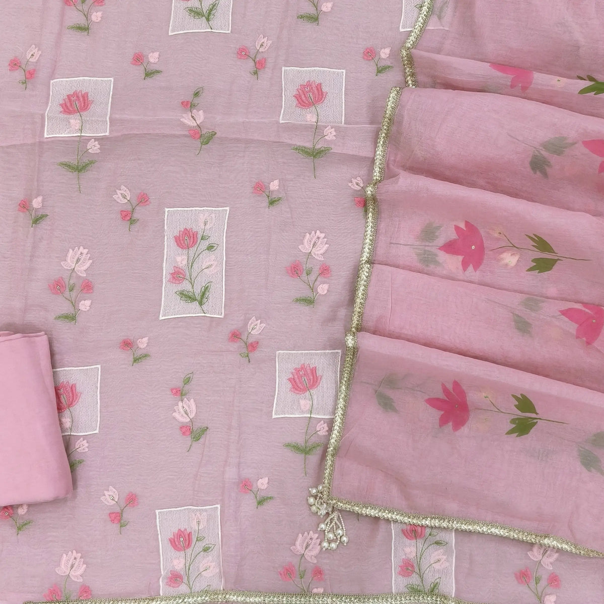 Designer pastel pink mul chanderi unstitched salwar material,rich floral thread embroidery work on front, ( soft,lining needed)santoon bottom, hand brush paint work on mul chanderi dupatta with lace tapping and beaded tassles. OC260902