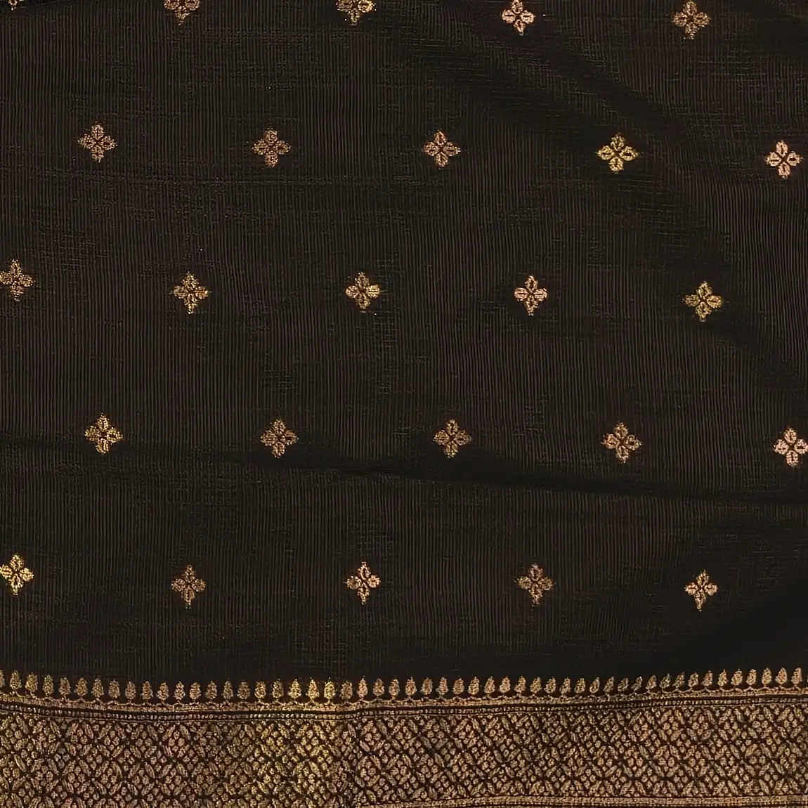Black premium ribbed silk saree(textured,thin)with silver and antique gold zari,weaving all over,antique gold zari woven pallu,running blouse with zari woven buttas and borders. NS250