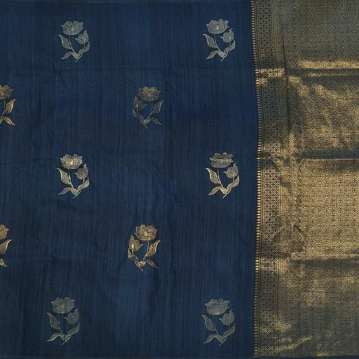 Dark turquoise blue premium ribbed silk saree(textured,thin)with silver and antique gold zari,weaving all over,antique gold zari woven pallu,running blouse with zari woven buttas and borders. NS348