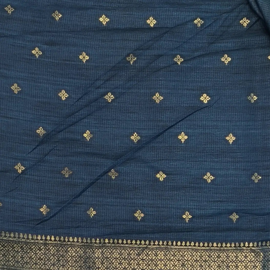Dark turquoise blue premium ribbed silk saree(textured,thin)with silver and antique gold zari,weaving all over,antique gold zari woven pallu,running blouse with zari woven buttas and borders. NS348