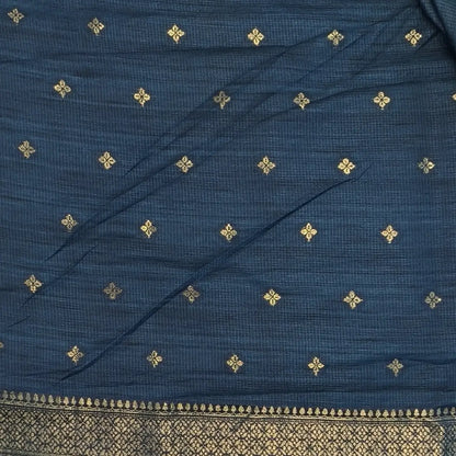 Dark turquoise blue premium ribbed silk saree(textured,thin)with silver and antique gold zari,weaving all over,antique gold zari woven pallu,running blouse with zari woven buttas and borders. NS348