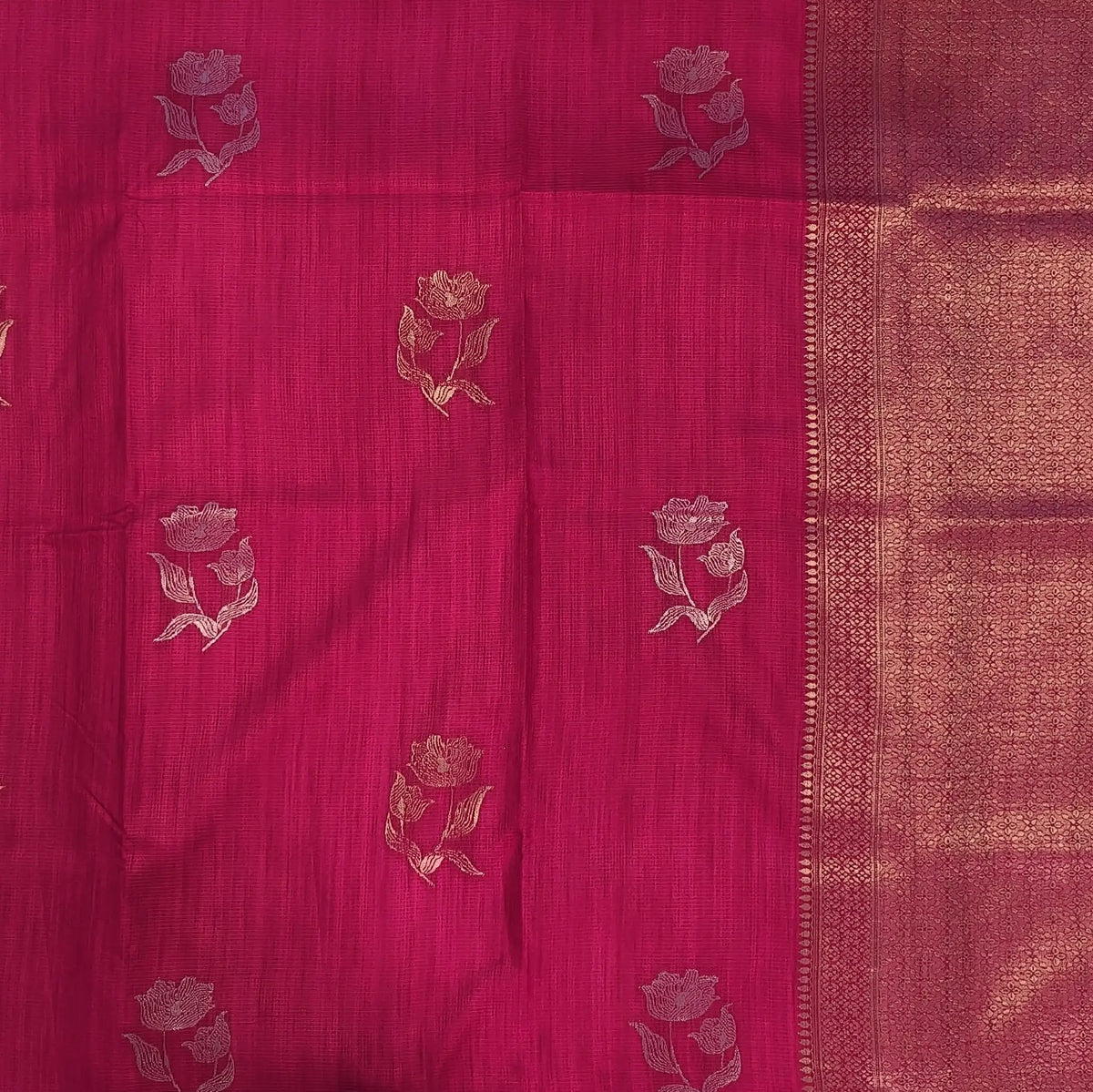 Bright pink premium ribbed silk saree(textured,thin)with silver and antique gold zari,weaving all over,antique gold zari woven pallu,running blouse with zari woven buttas and borders. NS247