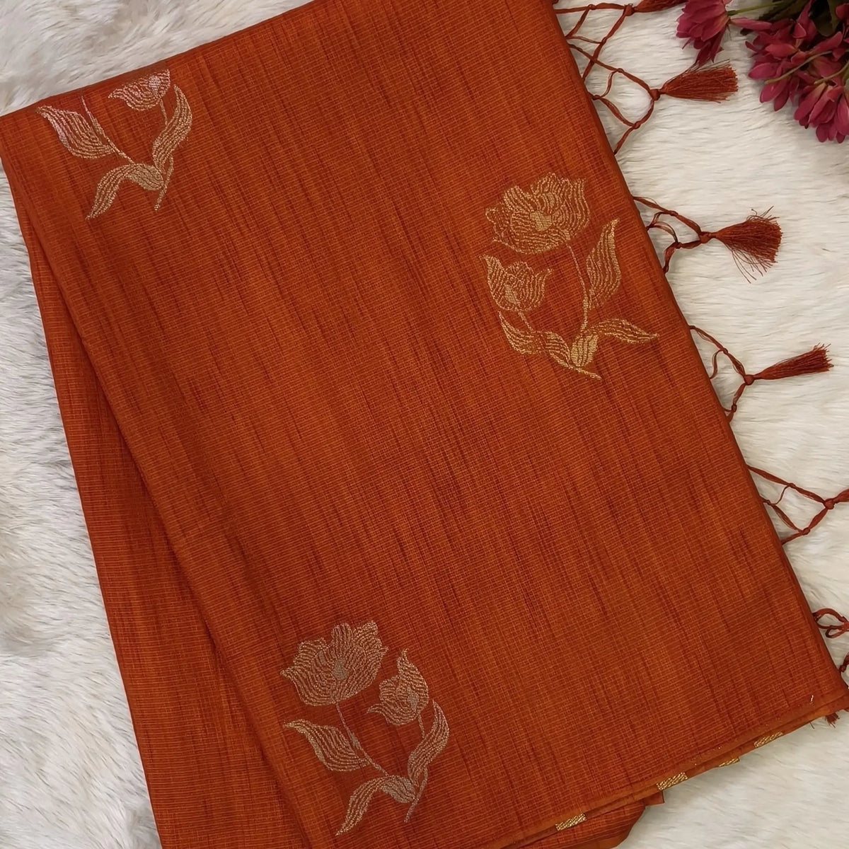 Rust orange premium ribbed silk saree(textured,thin)with silver and antique gold zari,weaving all over,antique gold zari woven pallu,running blouse with zari woven buttas and borders. NS256