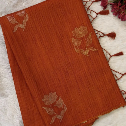 Rust orange premium ribbed silk saree(textured,thin)with silver and antique gold zari,weaving all over,antique gold zari woven pallu,running blouse with zari woven buttas and borders. NS256