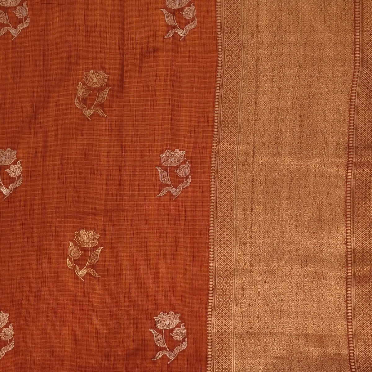 Rust orange premium ribbed silk saree(textured,thin)with silver and antique gold zari,weaving all over,antique gold zari woven pallu,running blouse with zari woven buttas and borders. NS256