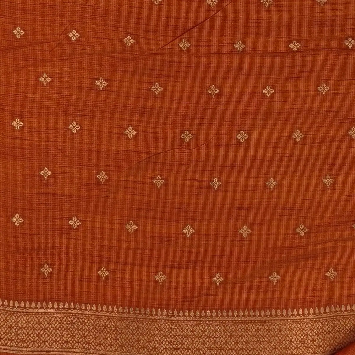 Rust orange premium ribbed silk saree(textured,thin)with silver and antique gold zari,weaving all over,antique gold zari woven pallu,running blouse with zari woven buttas and borders. NS256