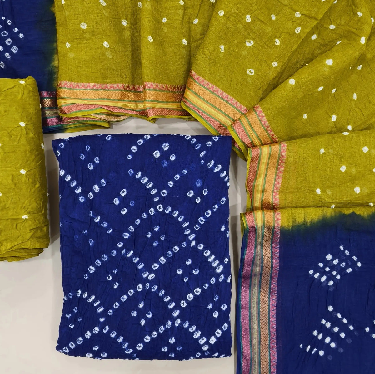 Royal blue bandhini tie and dye pure cotton unstitched salwar material,(lining needed)mehandhi green tie and dye cotton bottom,dual shaded tie and dye mul cotton dupatta with resham borders. OC261306