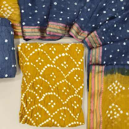 Mehandhi yellow bandhini tie and dye pure cotton unstitched salwar material,(lining needed)grey tie and dye cotton bottom,dual shaded tie and dye mul cotton dupatta with resham borders. OC261308