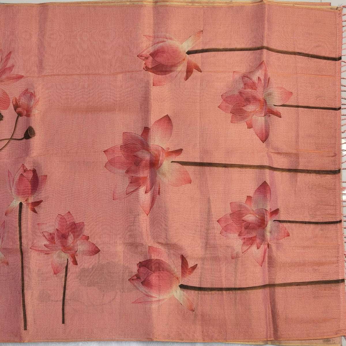 Pastel pink with golden tint tissue silk cotton saree(textured)with lotus digital prints all over,printed pallu,digital printed tissue silk cotton blouse with borders. NS268