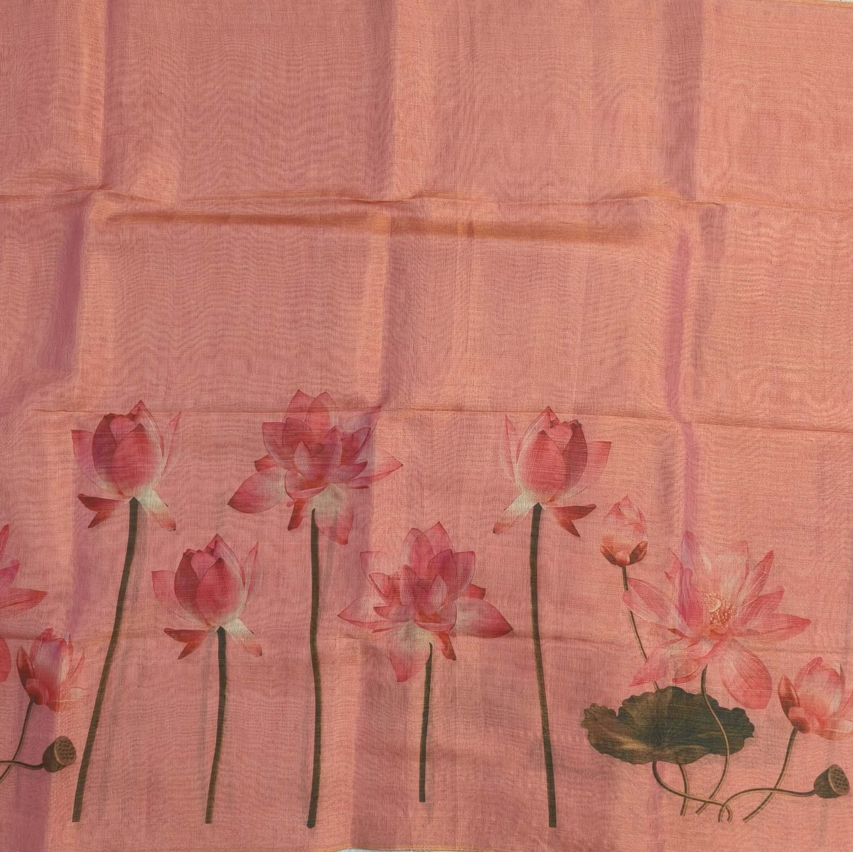 Pastel pink with golden tint tissue silk cotton saree(textured)with lotus digital prints all over,printed pallu,digital printed tissue silk cotton blouse with borders. NS268