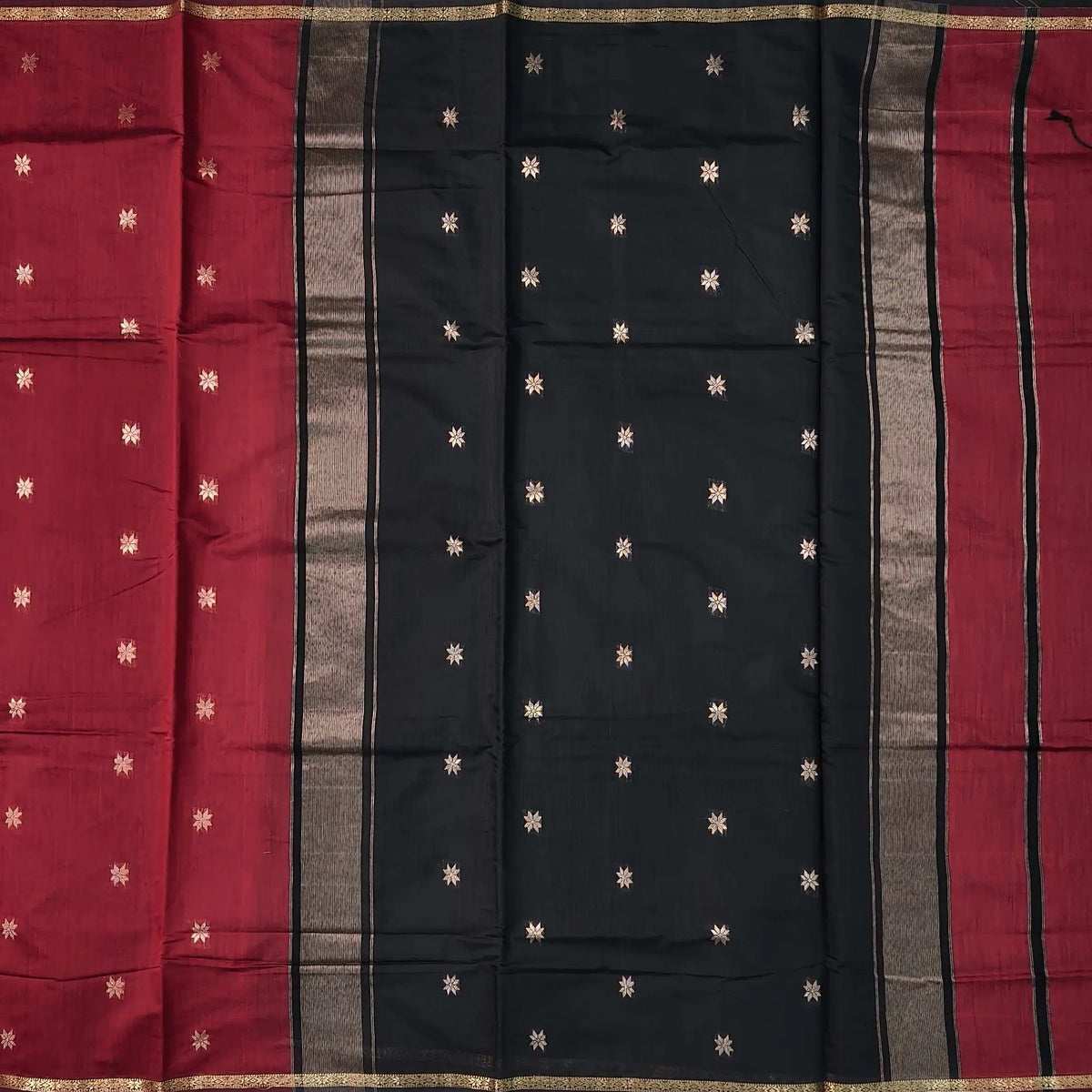 Black and maroon semi maheshwari silk cotton saree (thin, lightweight) zari woven borders and buttas all over, contrast pallu, plain running blouse with borders. NS360