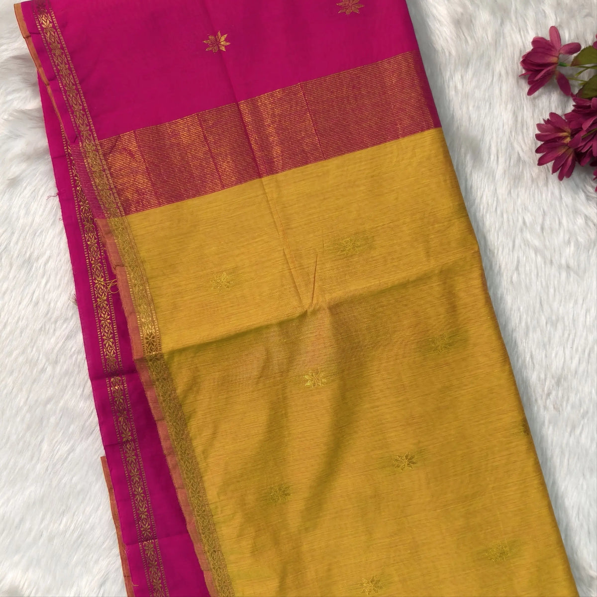 Bright pink and yellow semi maheshwari silk cotton saree (thin, lightweight) zari woven borders and buttas all over, contrast pallu, plain running blouse with borders. NS361
