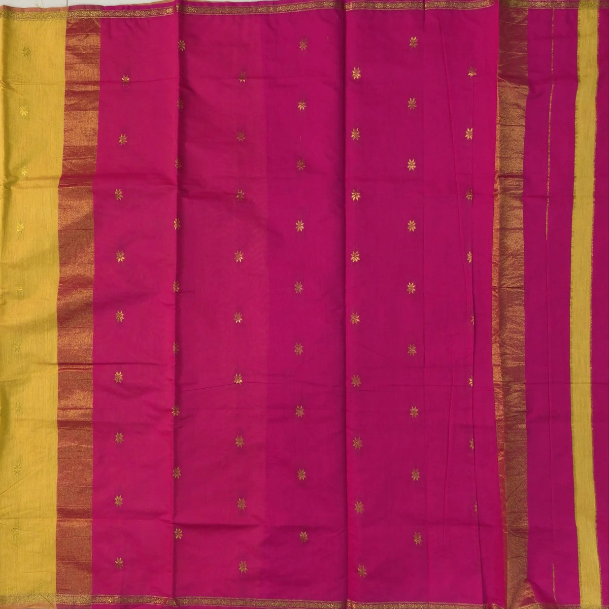 Bright pink and yellow semi maheshwari silk cotton saree (thin, lightweight) zari woven borders and buttas all over, contrast pallu, plain running blouse with borders. NS361