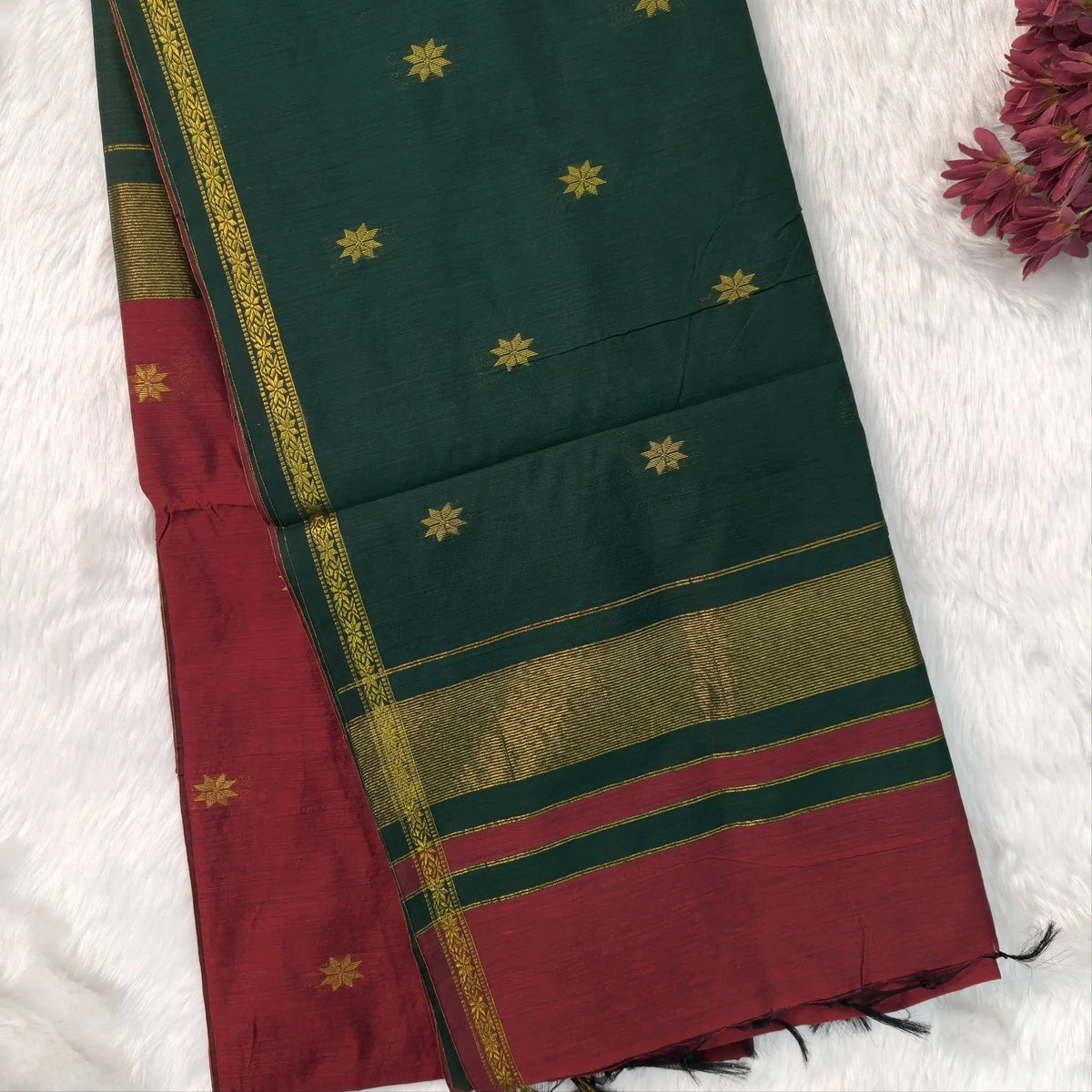 Bottle green and maroon semi maheshwari silk cotton saree (thin, lightweight) zari woven borders and buttas all over, contrast pallu, plain running blouse with borders. NS362