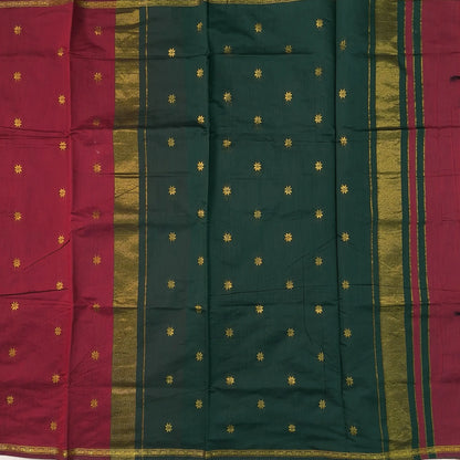 Bottle green and maroon semi maheshwari silk cotton saree (thin, lightweight) zari woven borders and buttas all over, contrast pallu, plain running blouse with borders. NS362