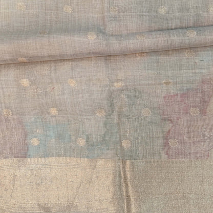 Beige premium jamdani woven silk cotton saree,with zari woven buttas all over,gold zari woven double side borders,jamdani weaving on pallu with tassles, running blouse with zari buttas and borders. NS254