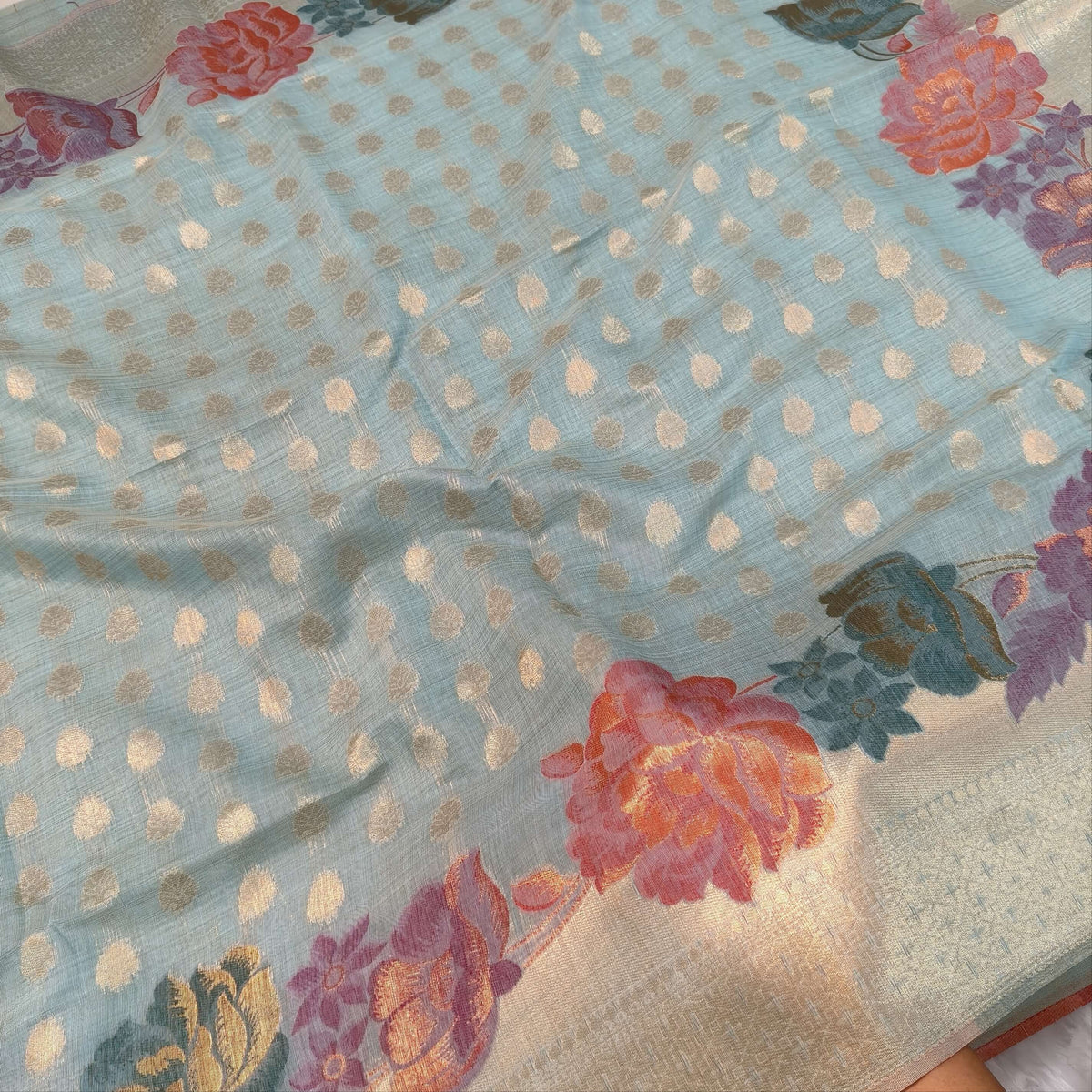 Pastel blue premium jamdani woven silk cotton saree,with zari woven buttas all over,gold zari woven double side borders,jamdani weaving on pallu with tassles, running blouse with zari buttas and borders. NS251