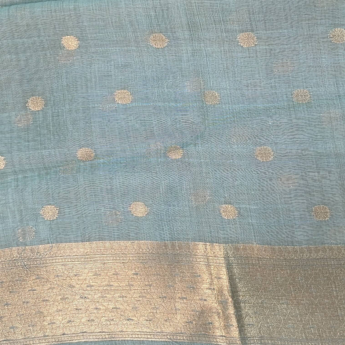 Pastel blue premium jamdani woven silk cotton saree,with zari woven buttas all over,gold zari woven double side borders,jamdani weaving on pallu with tassles, running blouse with zari buttas and borders. NS251