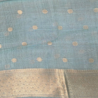 Pastel blue premium jamdani woven silk cotton saree,with zari woven buttas all over,gold zari woven double side borders,jamdani weaving on pallu with tassles, running blouse with zari buttas and borders. NS251