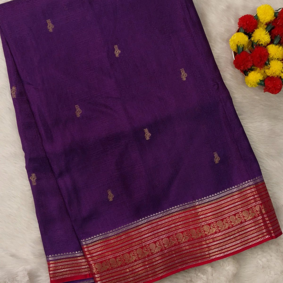 Purple jakard viscous silk saree with zari woven buttas all over, contrast double side gold and silver zari woven border (Silky, Thin)Contrast pallu with striped, crepe silk blouse with zari buttas. NS368