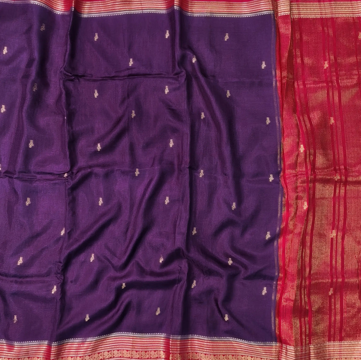 Purple jakard viscous silk saree with zari woven buttas all over, contrast double side gold and silver zari woven border (Silky, Thin)Contrast pallu with striped, crepe silk blouse with zari buttas. NS368