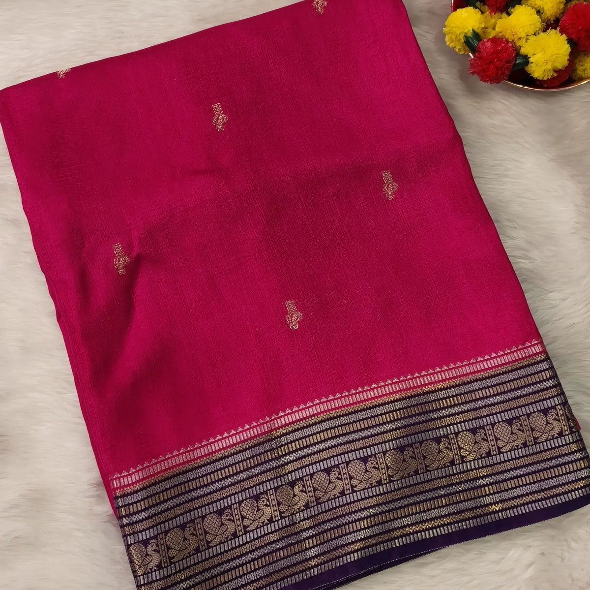 Bright pink jakard viscous silk saree with zari woven buttas all over, contrast double side gold and silver zari woven border (Silky, Thin)Contrast pallu with striped, crepe silk blouse with zari buttas. NS366