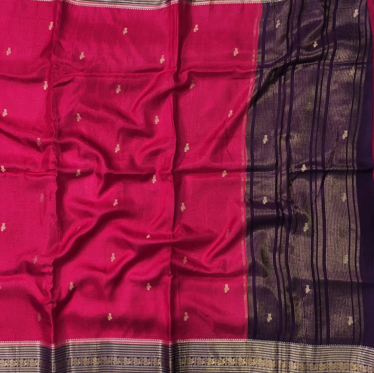 Bright pink jakard viscous silk saree with zari woven buttas all over, contrast double side gold and silver zari woven border (Silky, Thin)Contrast pallu with striped, crepe silk blouse with zari buttas. NS366