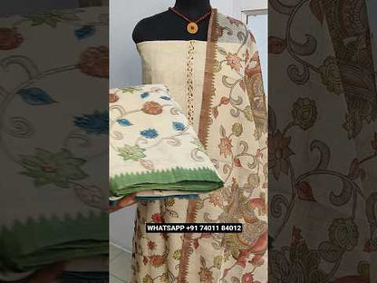 Beige with golden tint digital printed tissue linen unstitched salwar material, hand embroidered on yoke& front(thin, lining needed)dark grey santoon bottom, kalamkari printed tissue linen dupatta. CODE JL253103
