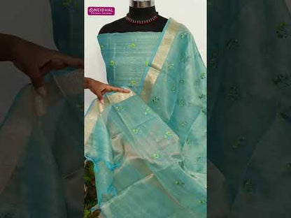 Pastel green designer tissue silk cotton unstitched salwar material, thin zari lines all over, applique work on daman(thin, lining needed)matching silk cotton bottom, embroidered tissue silk cotton dupatta with zari woven borders. CODE AG253102