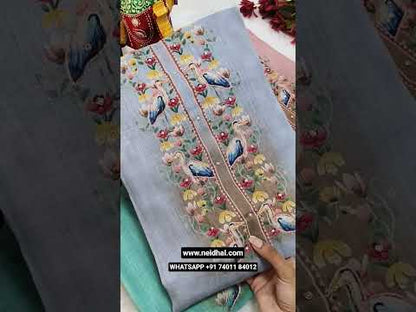 Light green digital printed semi linen unstitched salwar material, thread& zardozi work on yoke(thin, lining needed)dark green santoon bottom, digital printed semi linen dupatta with silver tissue borders. CODE JL250520