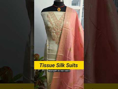 Half white with golden tint pure tissue silk unstitched salwar material, v neck with heavy zari &sequins work(thin, lining needed)matching spun cotton bottom, silk cotton dupatta with zari buttas& borders. CODE AG250701