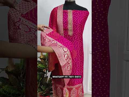 Bright pink designer pure dola silk unstitched salwar material, heavy work on yoke, thread weaving all over, rich daman(lining needed)matching santoon bottom, bandhini woven design full length dupatta with zari borders.  CODE AG251103