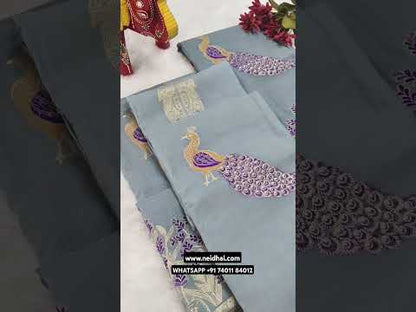 Light grey mul chanderi silk cotton unstitched salwar material, rich zari& thread weaving on yoke& front(thin, lining needed)violet silk cotton bottom, mul chanderi silk cotton dupatta with rich zari& thread weaving. CODE JN251501