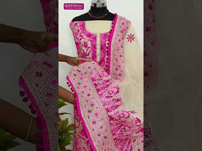 Light beige designer premium silk cotton unstitched salwar material, heavy hand embroidery on front(lining needed)matching santoon bottom, rich hand embroidered premium silk cotton dupatta with pompom tapings. CODE SP250311