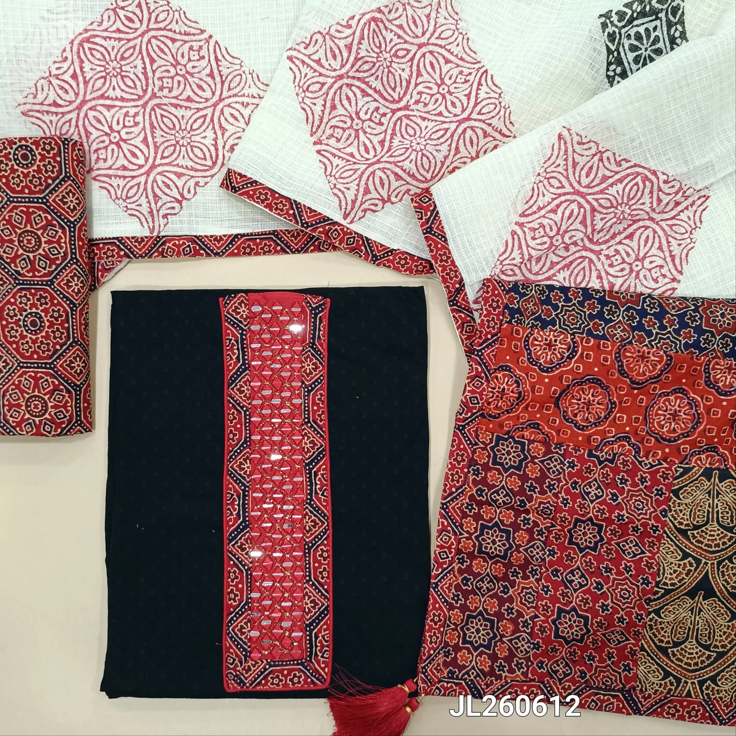 Black dobby cotton unstitched salwar material,ajrak &real mirror work on yoke,self weaving design(RED)(lining needed)ajrak block printed cotton bottom, block printed kota dupatta with applique patch work on pallu. JL260612