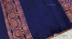 CODE WS838 :  Dark beetroot purple fancy silk cotton with copper zari woven buttas all over, zari woven borders in contrast colour, contrast copper zari woven pallu ,running navy blue blouse with borders.