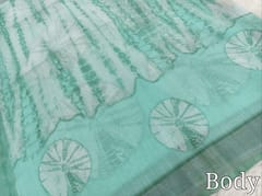 CODE WS1335 :Sea Green fancy semi linen saree with shibori design all over,silver tissue borders,printed running blouse