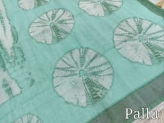 CODE WS1335 :Sea Green fancy semi linen saree with shibori design all over,silver tissue borders,printed running blouse