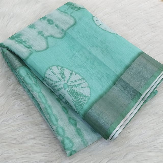 CODE WS1335 :Sea Green fancy semi linen saree with shibori design all over,silver tissue borders,printed running blouse