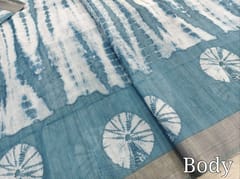 CODE WS1338 :Blue fancy semi linen saree with shibori design all over,silver tissue borders,printed running blouse