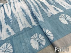 CODE WS1338 :Blue fancy semi linen saree with shibori design all over,silver tissue borders,printed running blouse