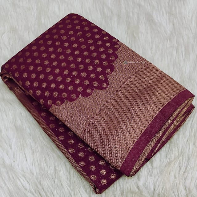 CODE WS1195 : Beetroot purple banarasi viscous georgette saree with antique gold zari woven buttas all over,zari woven pallu and rich zari woven pallu(lightweight)contrast dark green blouse with zari woven buttas with borders.